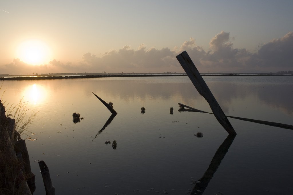 Reflective saltpans and therapeutic lye pools of Pomorie Lake with bird hides